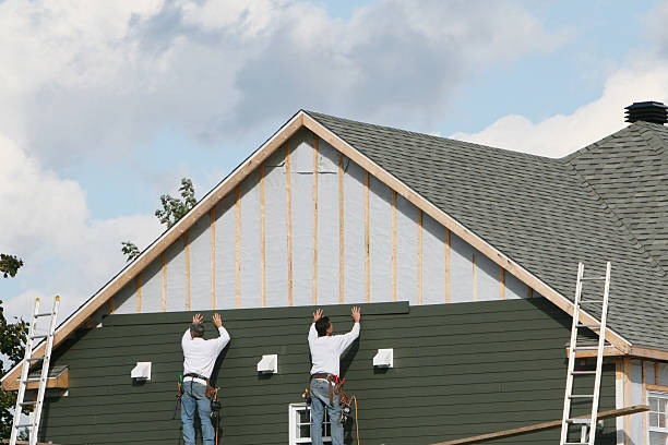 Professional Siding technician working in Merrick, NY